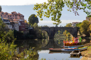 Scenic river view with colorful boats in Amarante