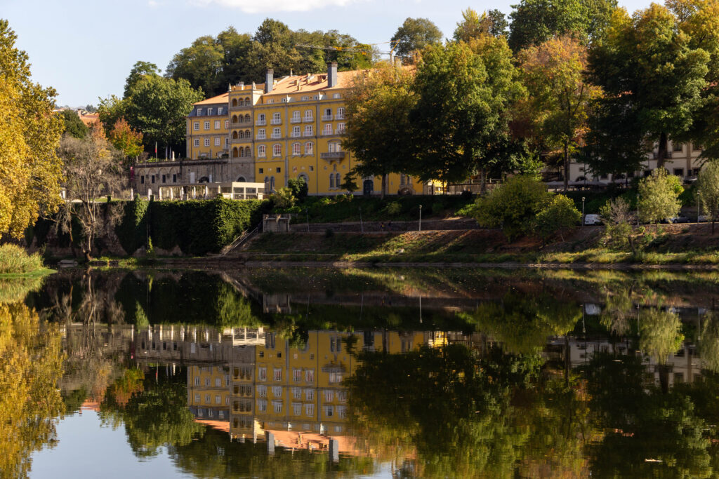 Yellow building reflecting in water